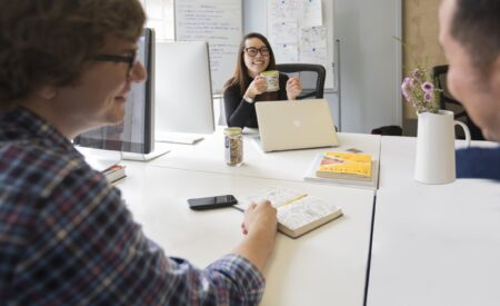Group of colleagues sitting around a table talking