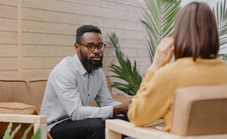 Seated man and woman talking